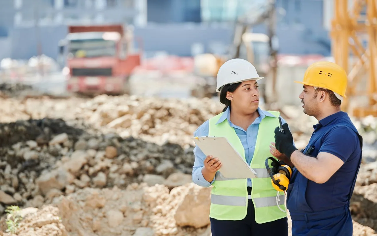 A crew running through the day’s brief on a tablet on site, instead of a paper sheet that is lost by lunch.